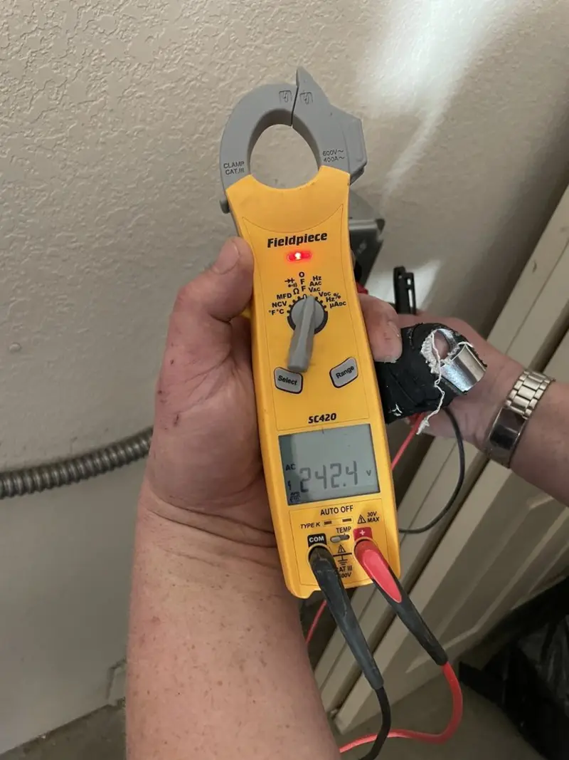 Voltage testing with clamp meter during Recessed Lighting Installation in Upper Macungie